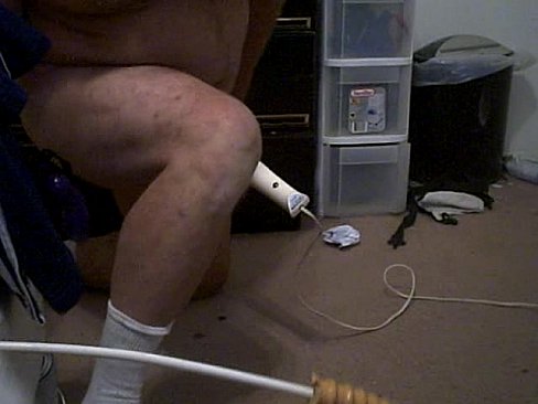 man with penis pump and dildo