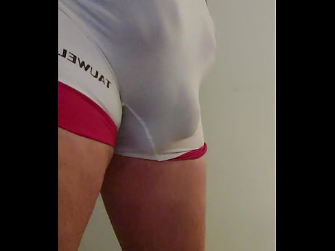 Stretching my cock to hang out of my singlet