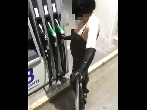 walking fetish dressed in a gas station between trucks as a real lot lizard