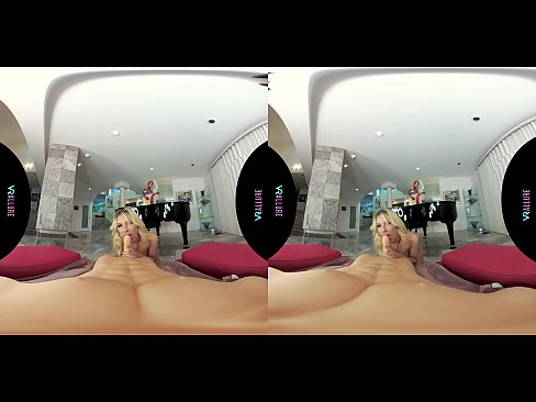 Beautiful busty blonde masturbates with a sex toy in virtual reality