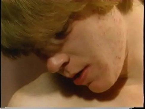 Blond twink sucks off thee haed poles of older guys in a bathroom stall