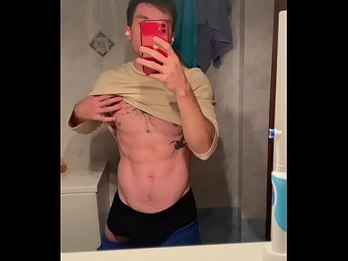 Young stud teasing with his hard cock while wearing sweatpants