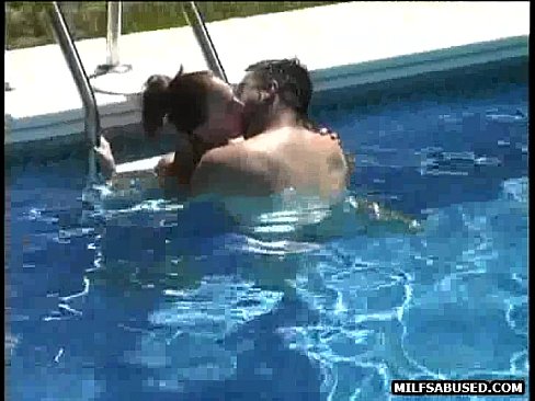 This sexy redhead milf is eaten out and fucked in the pool