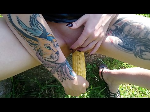 Shameless Lucy Ravenblood pleasure her cunt with corn outdoor in the sunshine