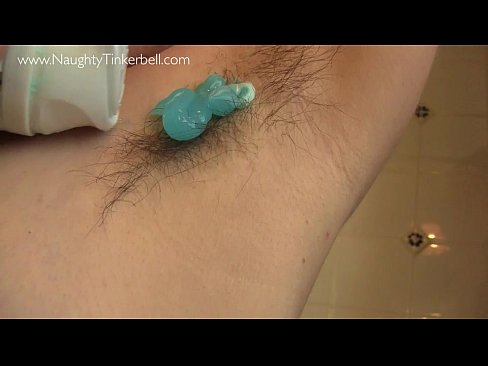 Sexy scene, Naughty Tinkerbell is shaving her hairy pierced pussy in the shower.
