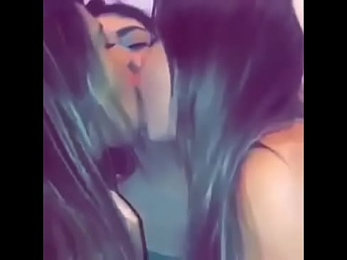 three teens kiss