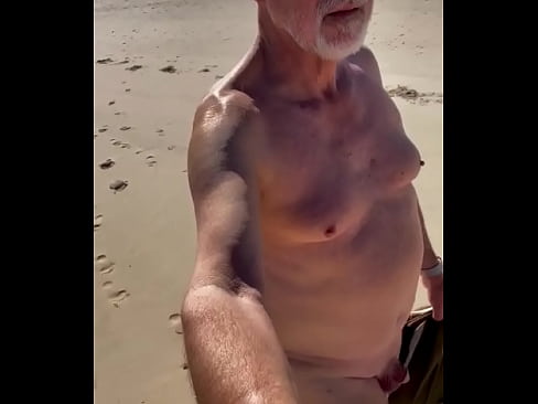 Walking nude on the beach