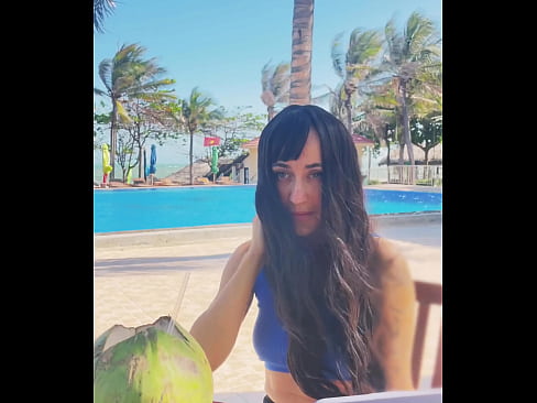 Sexy beauty girl and coconut. Poolside beautiful alert!