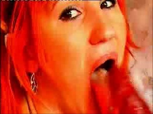 Cute horny redhead sucking a huge red dildo