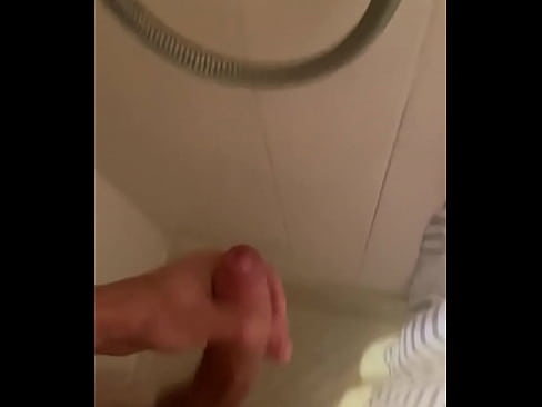 Tugging cock in the shower