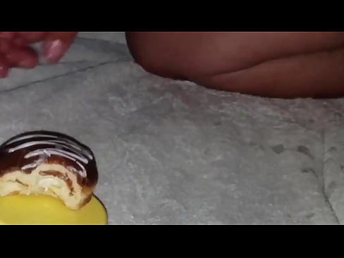 Chocolate donut gets cum covered and eaten.