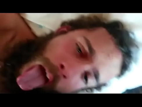 Bearded dude gets shot in the face with jizz from his buddy.