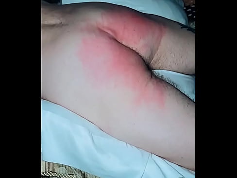 Part of a spanking with a  Leather belt