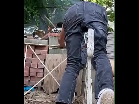 Mayofascial Pain Relief stretching on handrail in denim jeans