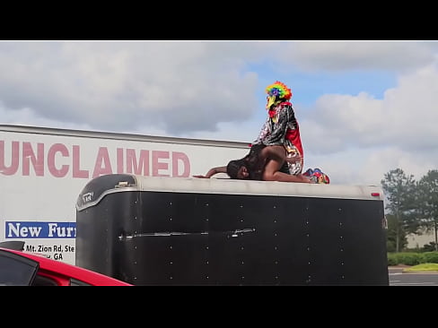 Gibby the clown fucks Ebony pornstar on top of trailer