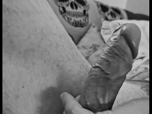 Heavily tattooed male solo session cumshot