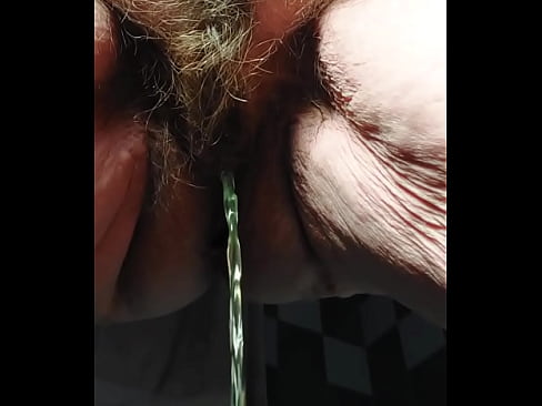 Granny peeing and using cucumber  in hairy pussy