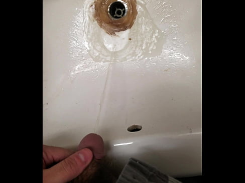 Pissing in a sink at work