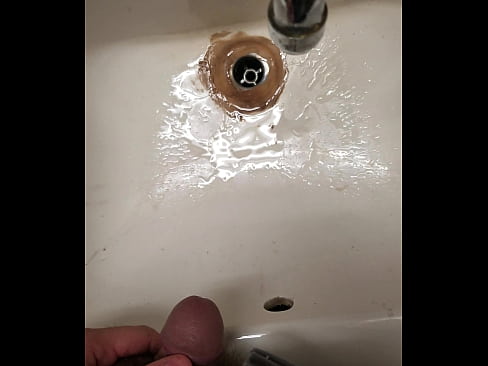 Pissing in a sink at work