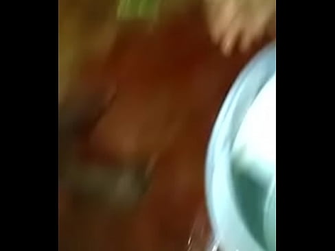 boy in bathroom with bucket