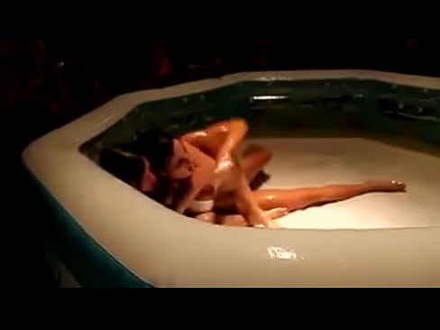 two sexy teens play figh in an oiled pool