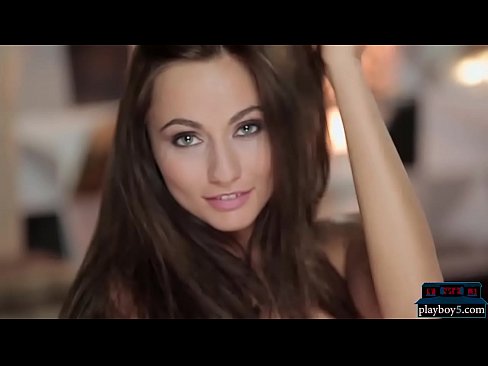 Gorgeous brunette model flirts with the camera and teases us