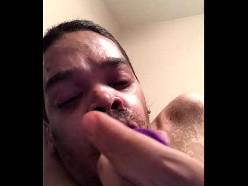 Sucking on a dildo