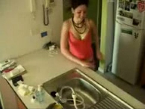 Brunette teen has an intense orgasm masturbating in the Kitchen sink