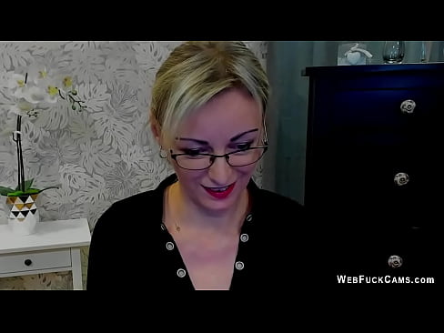 Braless blonde German MILF amateur in glasses LUXvanessa in black blouse with a big cleavage and orange mini skirt flashing panties