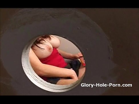 Plumb bigtit slut in public restroom rubs pussy and blows dick through gloryhole