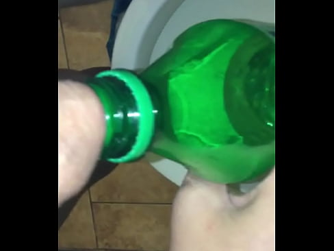 pissing in sprite bottole then pours warm pee on cock wipes wet dick on the wall