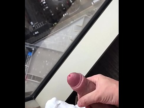 Me wanking with big cumshot over hotel room window, during daylight