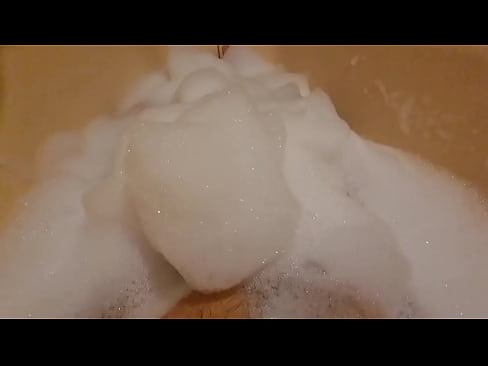 Bath full of foam with erection