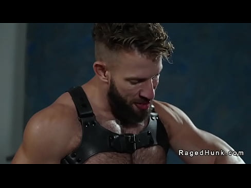 Kinky muscle gay Morgxn Thicke wearing only a harness and black boots gets blowjob from production assistant Cole Connor then fucks his hairy ass