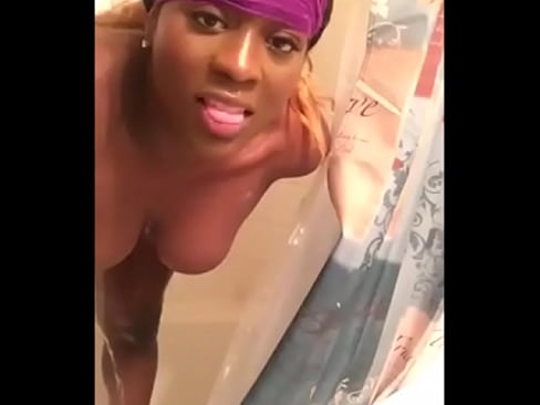 Busty Black Chick with a Dick Showering