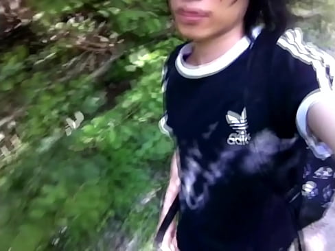 Gay twink pissing outdoors and walking sexy in the forest