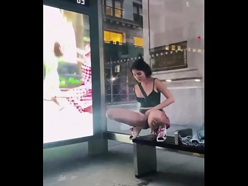 Violet Summers peeing at a bus stop