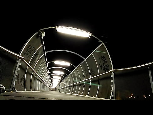 Naked on a lighted bridge