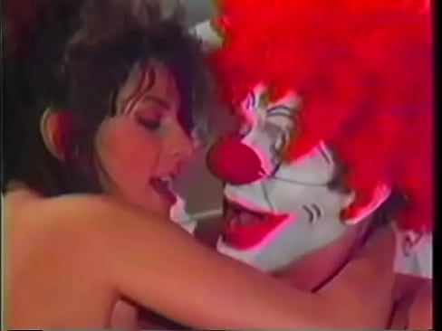 Brunette with a nice thick body gets her hairy pussy rocked by a clown
