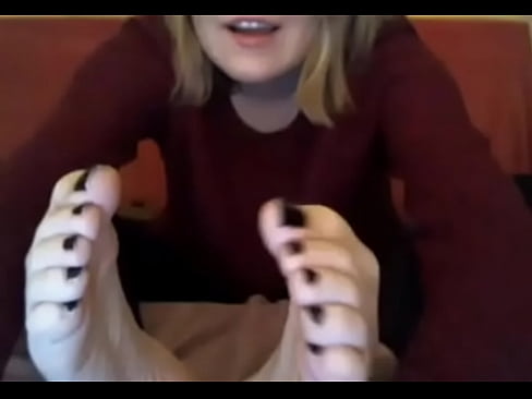 webcam model in sweatshirt suck her own toes