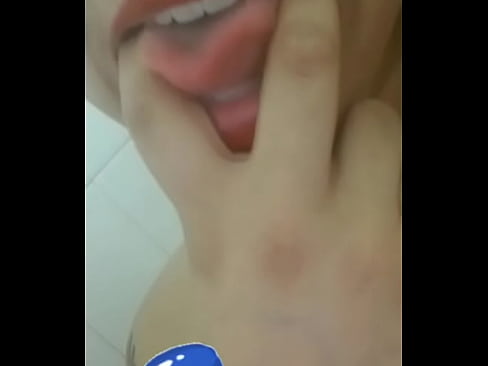 Latina sucks on her fingers in red lipstick