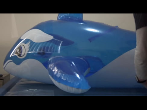 Inflatable blimp whale opening, pumping up and letting down