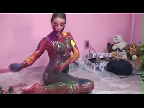 Teen Lina with perky tits exhibits her body as colorful art on floor