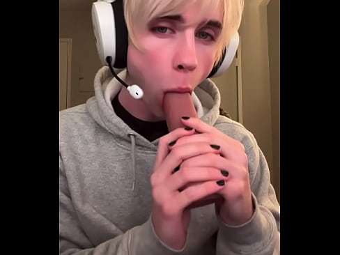 Blonde gamer boy and his toy