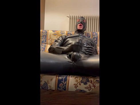 What a huge cock in latex and what a super cumshot