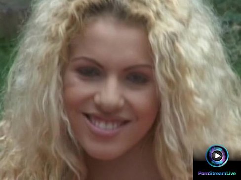 Curly haired blonde Jaqueline Stone giving a wet blowjob outdoors