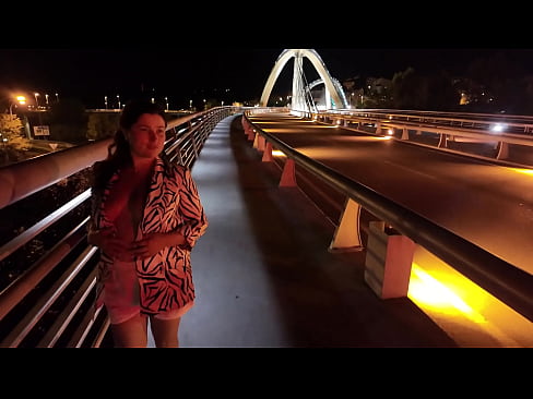 Luscious Milf walks without a Bra and Panties on the Bridge