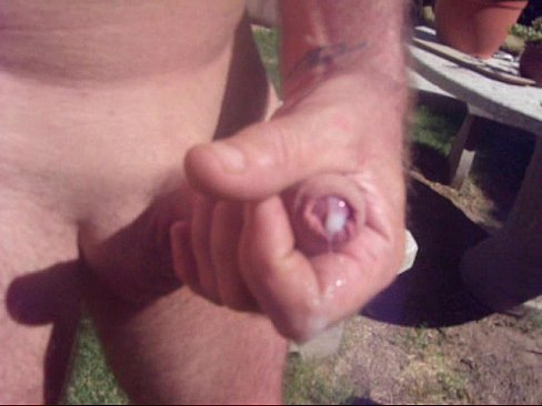 Close up cock and cum outdoors