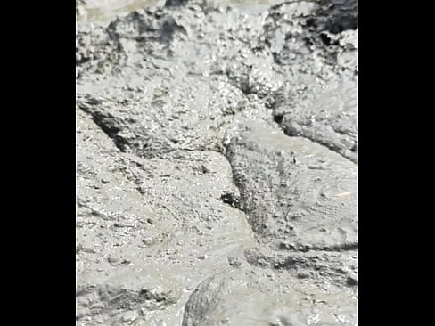 Male Transversing into Muddy Land Barefooted and Wallowing