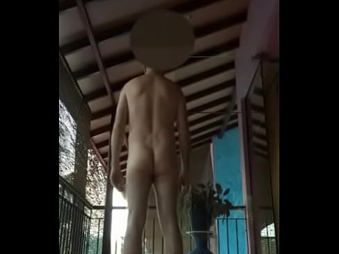 guy with soft cock strutting naked on balcony